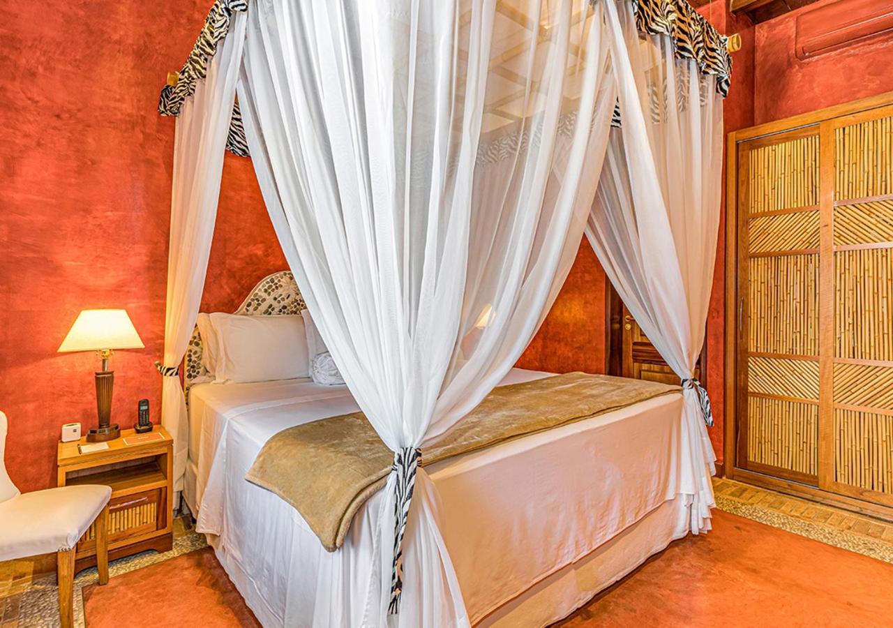 Dpny Beach Hotel & Spa 일랴벨라 외부 사진 A bed with a mosquito net